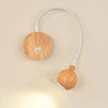 TimberGlow LED Wall Sconce | Elegant natural wood bedside lamp with directional lighting for indoor use