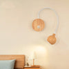 TimberGlow LED Wall Sconce | Elegant natural wood bedside lamp with directional lighting for indoor use