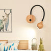 TimberGlow LED Wall Sconce | Elegant natural wood bedside lamp with directional lighting for indoor use