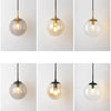 GlacioGlow Retro Glass Ball Sconce | Elegant post-modern bedside lamp for warm ambient lighting