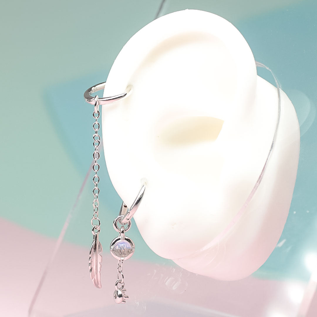 Feather Moonstone | Sterling Silver Asymmetrical Feather Earrings, White Moonstone