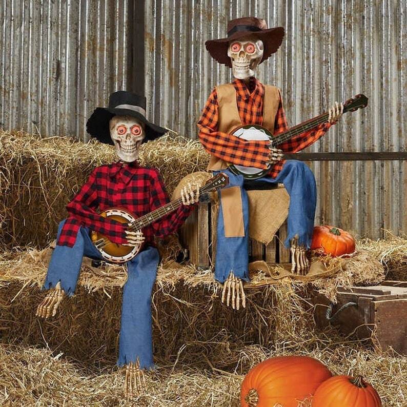 Hauntique Animated Skeleton Duo | Sound-activated Halloween decoration with music and lights