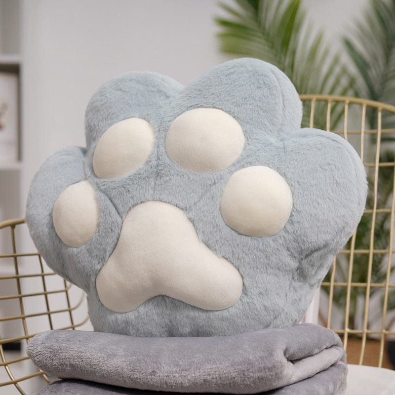 VeluPaws Heated Plush Cushion | Adorable cat paw hand warmer with a built-in heat pack and a soft blanket—perfect for chilly days.