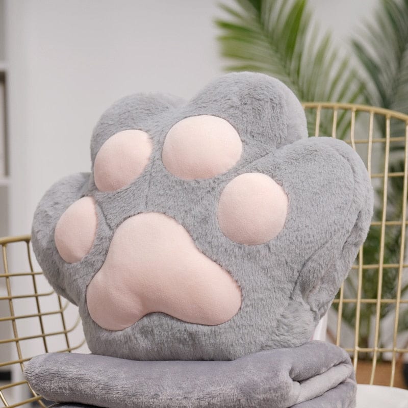 VeluPaws Heated Plush Cushion | Adorable cat paw hand warmer with a built-in heat pack and a soft blanket—perfect for chilly days.